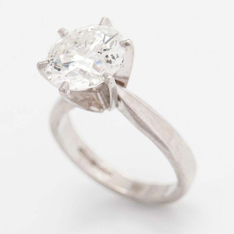 A platinum ring, with a brilliant-cut diamond approximately 3.10 ct. Domino Jewellery, Birmingham, England.