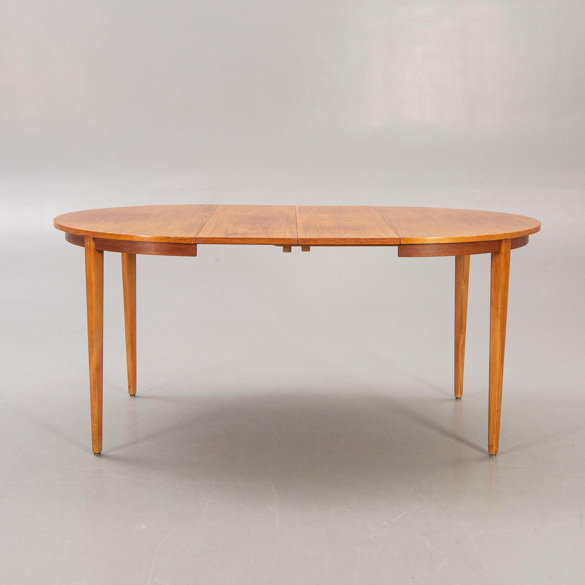 A 1960s teak dining table.