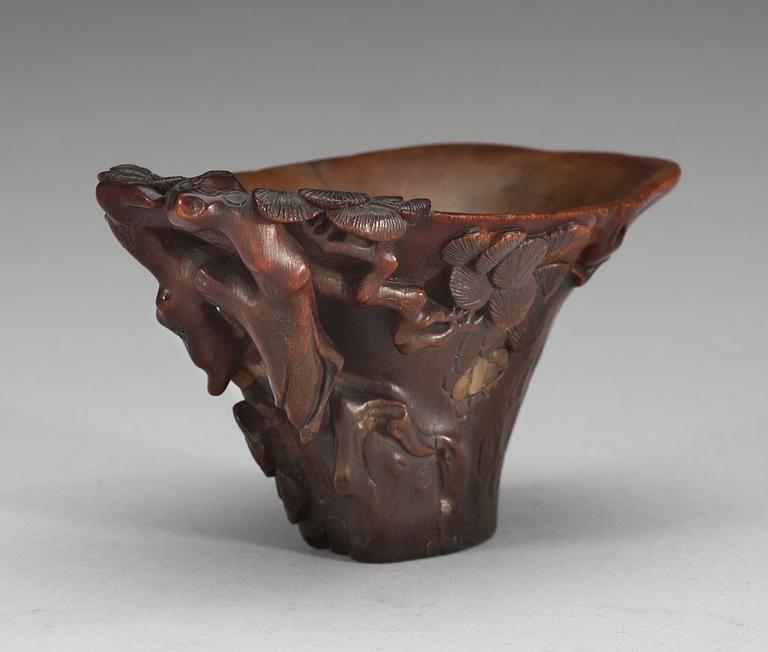 A rhinoceros libation cup, Qing dynasty, ca 1700.