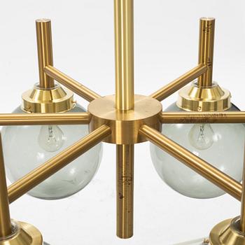 A brass and glass ceiling light, Luxus, later part of the 20th Century.