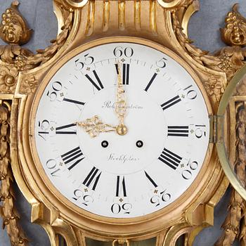 A gustavian style wall clock, signed Rob. Engström, Stockholm. First half of the 20th century.