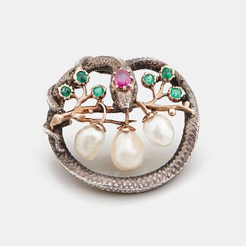 A Karl Rothmüller, Art Nouveau serpent brooch, circa 1900, with a ruby, emeralds and probably natural saltwater pearls.