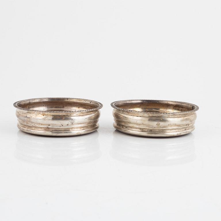 Two pairs of silverplate wine coasters, 20th century.