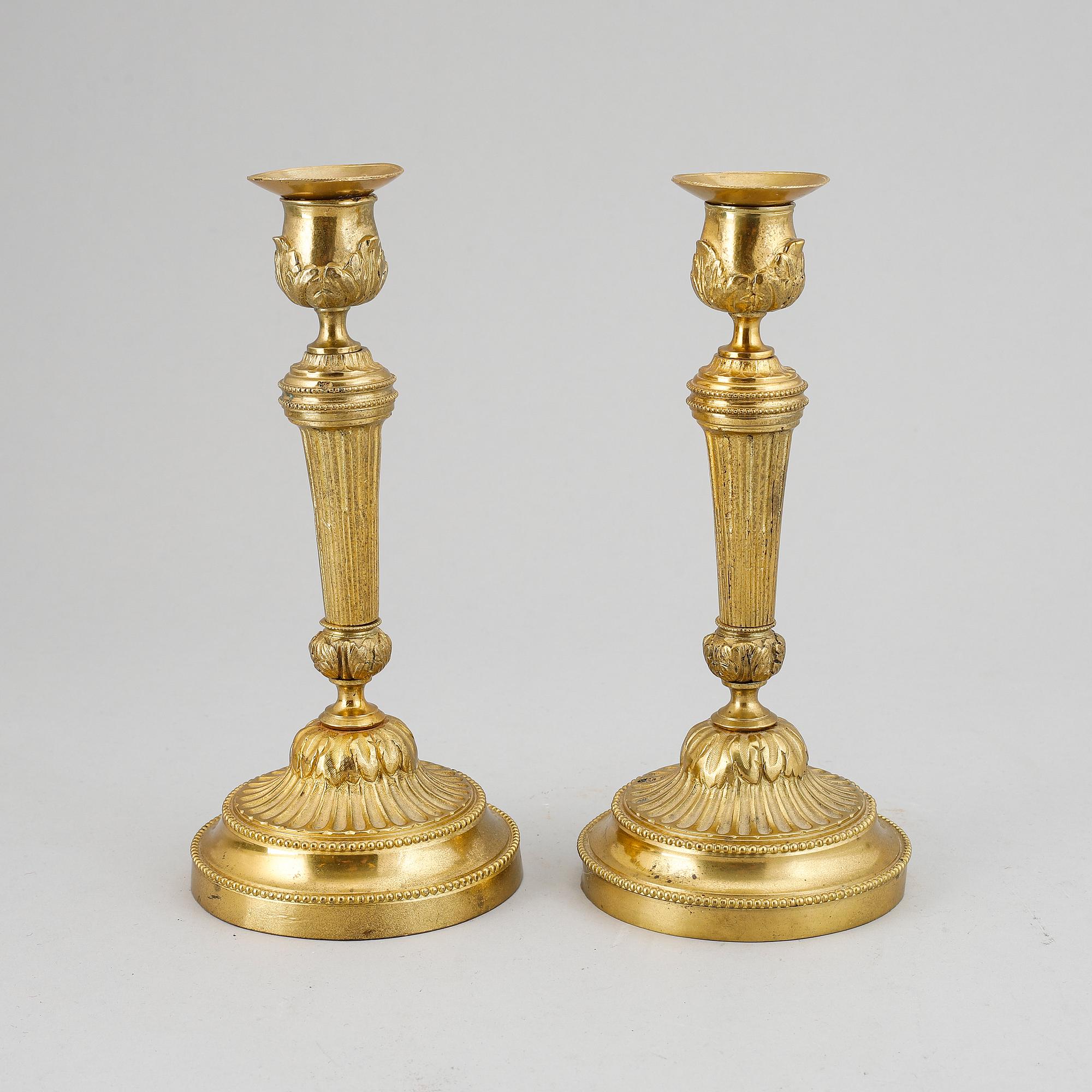 A pair of Louis XVI-style candlesticks, ca 1900.