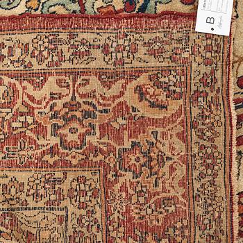 A carpet, an antique Kerman Laver, ca 677-688,5 x 510,5-526 cm.