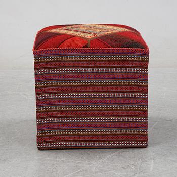 A kilim footstool.