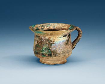 1141. JAR, pottery. Turquoise glaze with black decoration. Persia 13th-14th century.
