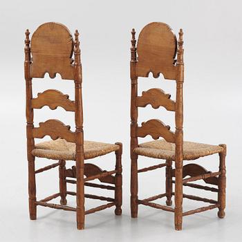 A pair of Spanish colonial style ladder-back chairs, circa 1900.