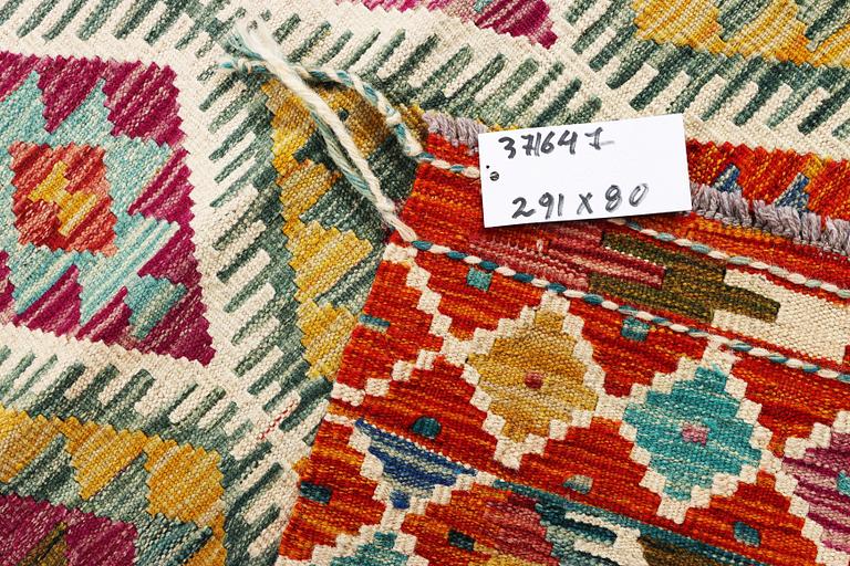 A Kilim runner carpet, c. 291 x 80 cm.