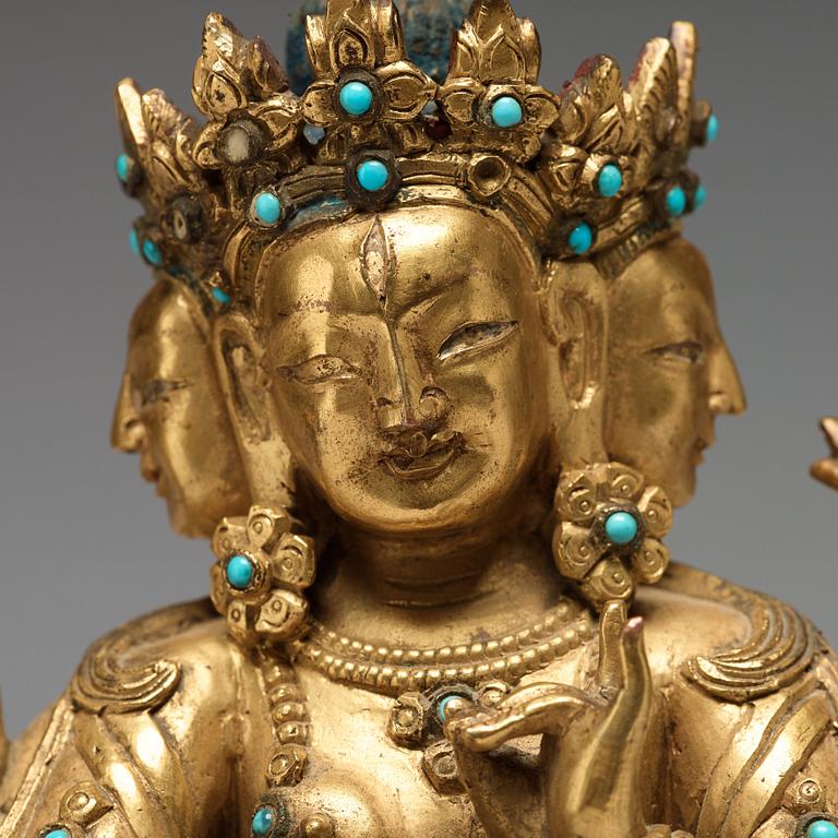 A Sino-Tibetan gilt copper alloy figure of Ushnisha Vinaya, late 18th century/circa 1800.