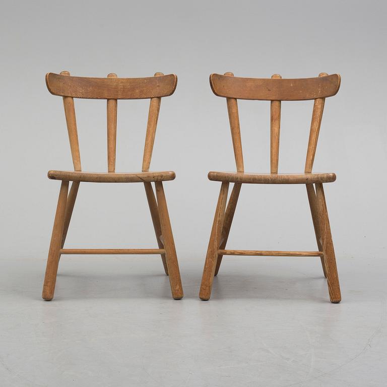 a paor of 1940's pine wood chairs.