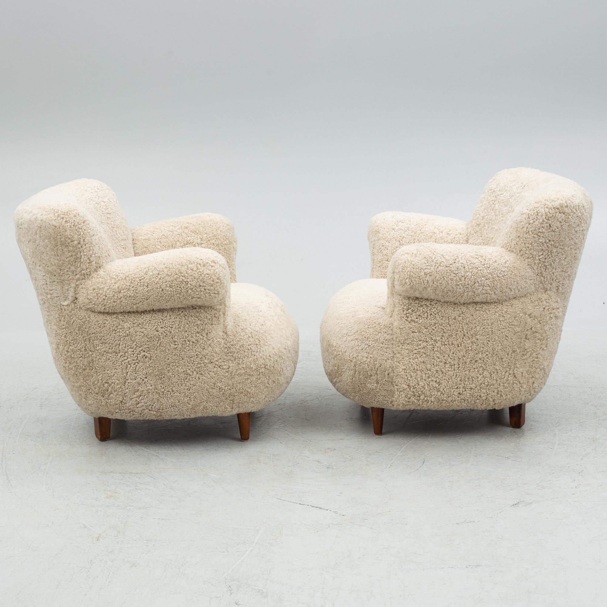 A pair of Swedish Modern easy chairs, mid 20th century.