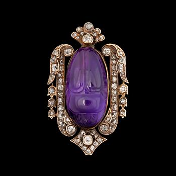 1082. An amethyst brooch, set with old-cut diamonds tot. 0.95 ct.