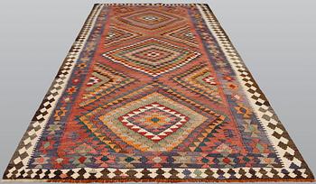 A persian nomadic kilim, approximately 420 x 190 cm.