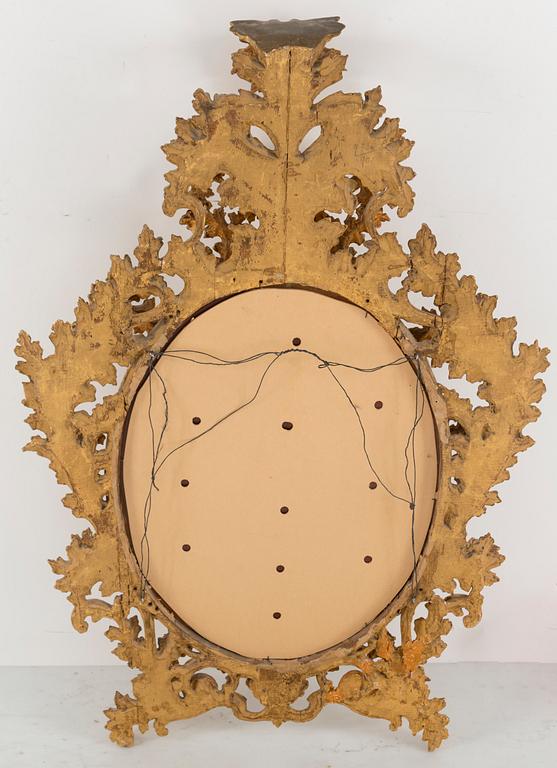 A 20th century Baroque style mirror.