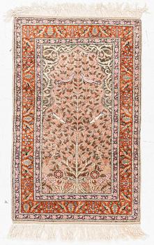 An oriental rug, c. 135 x 85 cm.