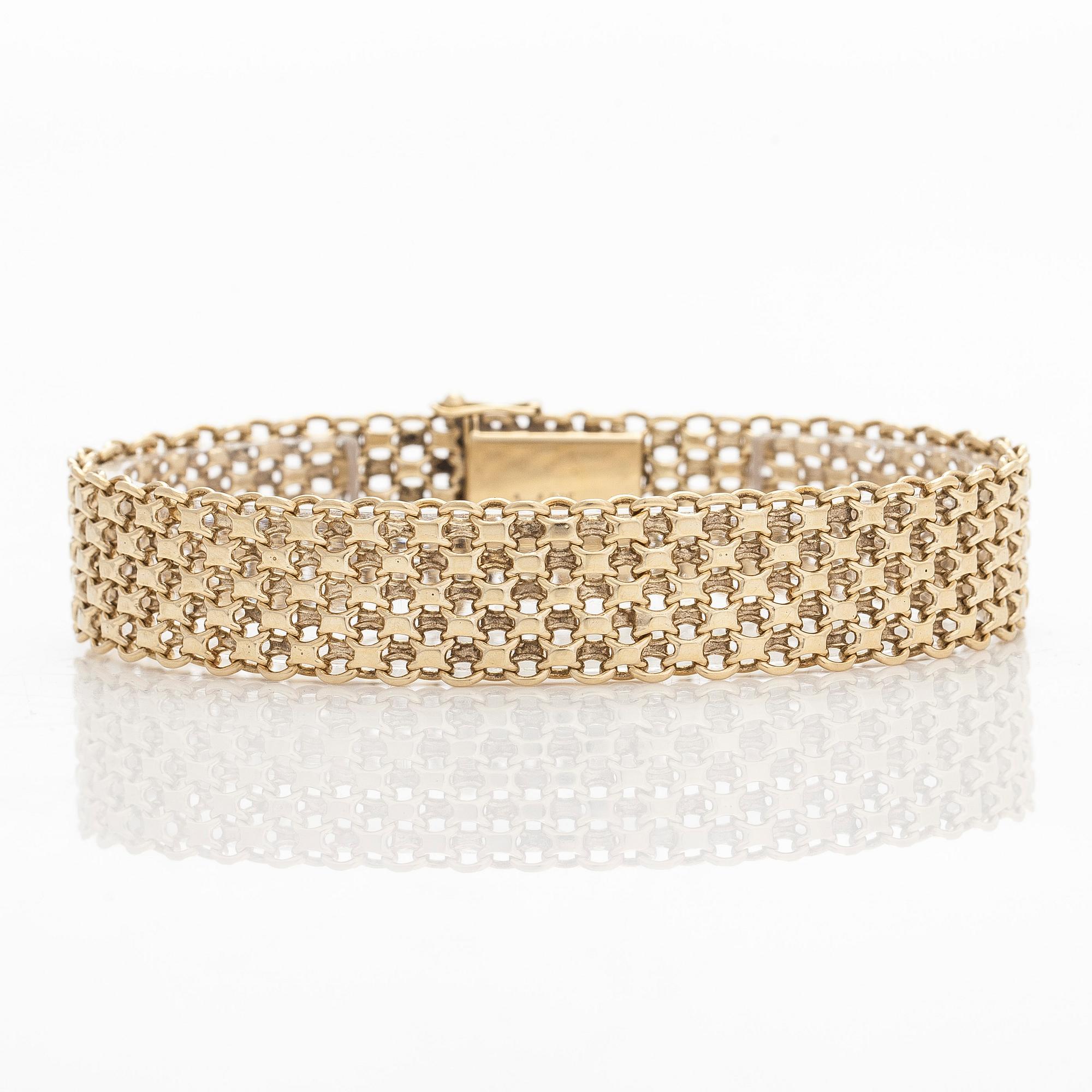 A 14K gold X-link bracelet, likely Norway.