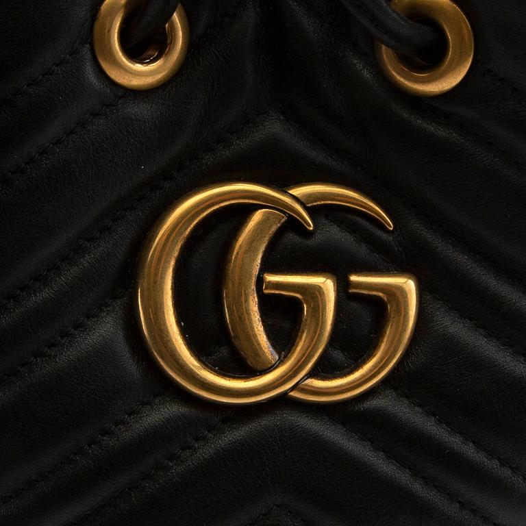 Gucci,.