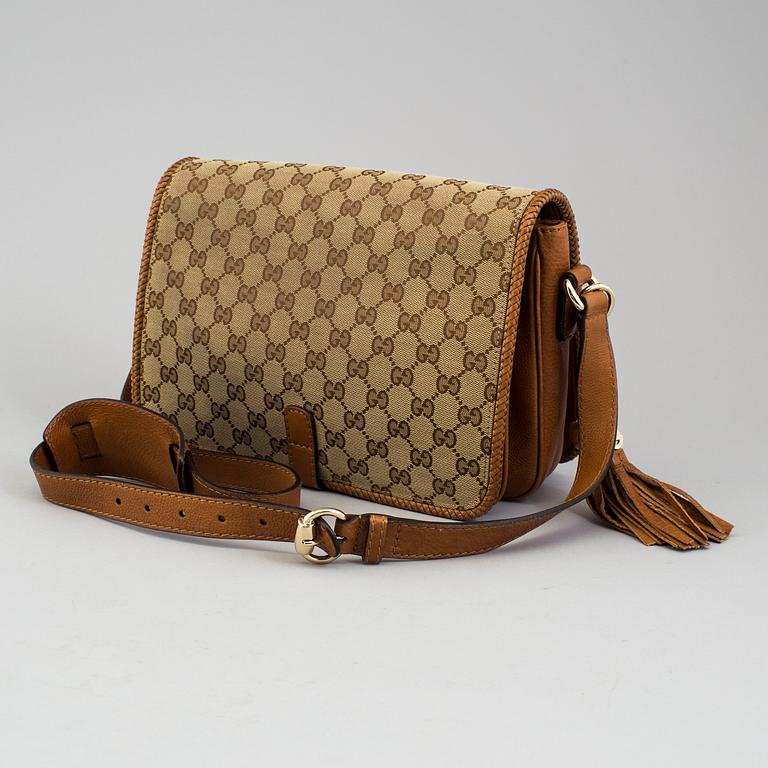 A 'Marrakech Medium Messenger Bag' by Gucci.