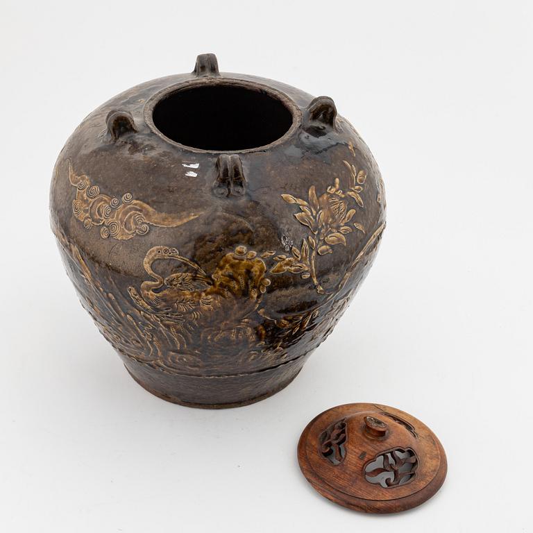 A large brown glazed marthaban jar, presumably late Ming dynasty (1368-1644).