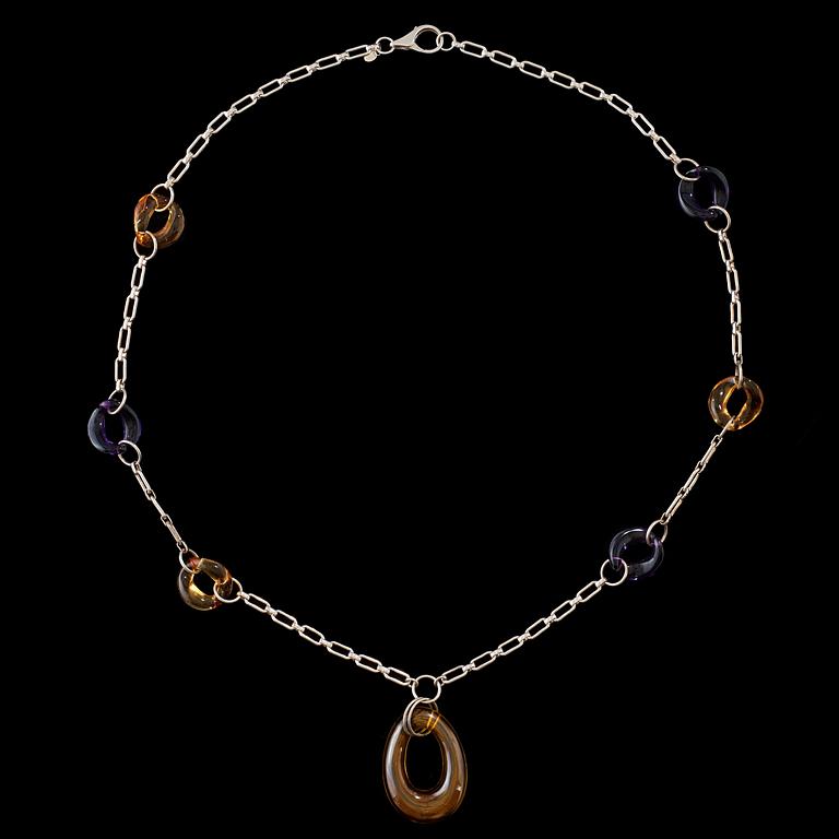 A silver, amethist and citrin necklace.