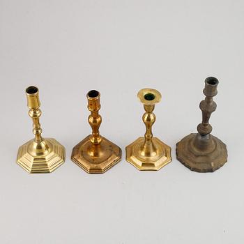 Four 18th century bronze candlesticks.