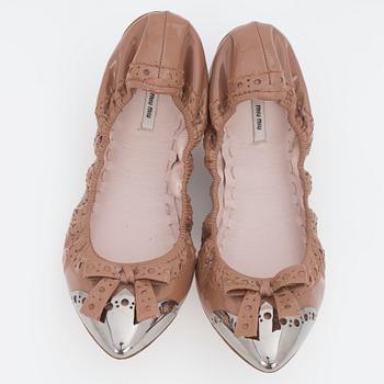 MIU MIU, a pair of leather ballet flats.