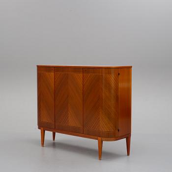 a 1950's mahogany cupboard.