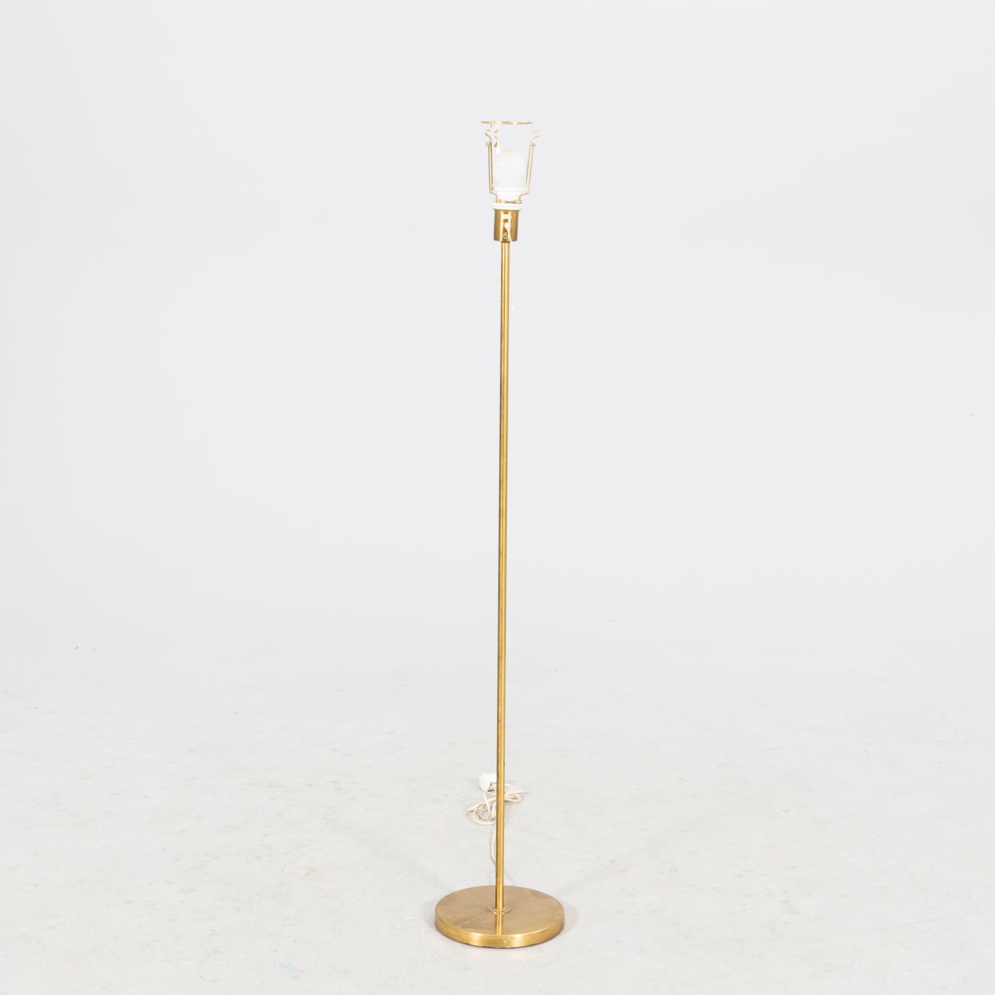 An NK 1960s brass floor lamp.