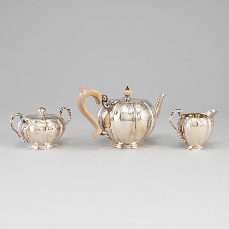 An English 20th century silver three piece tea-set, marked Crichton & Co Ltd, London 1925.