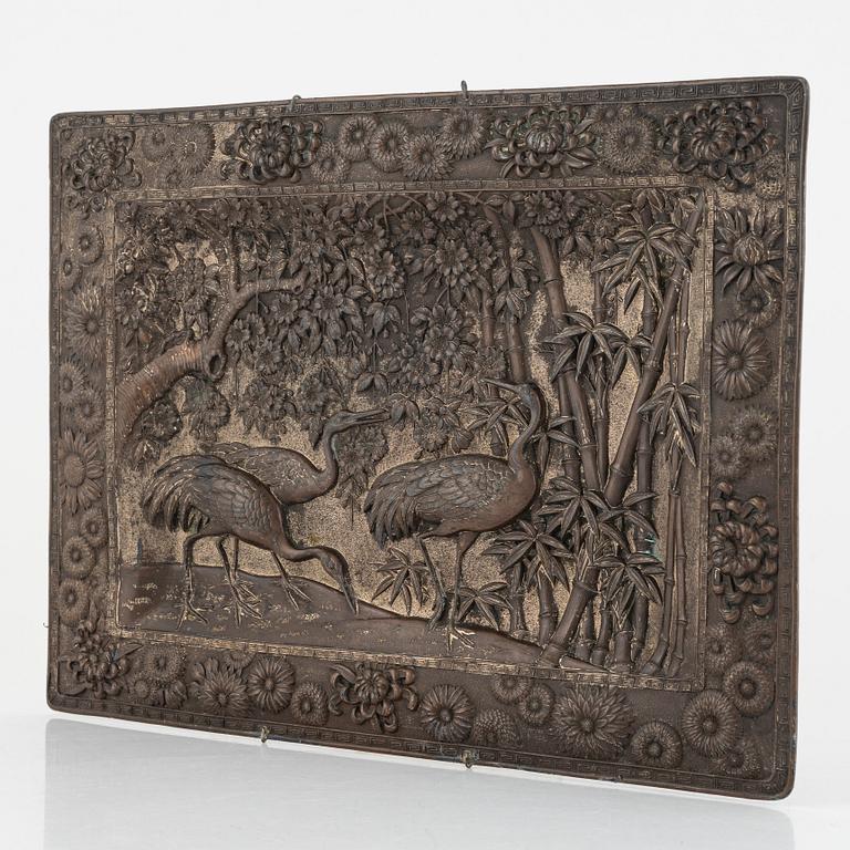 A Chinese copper relief, 20th century.