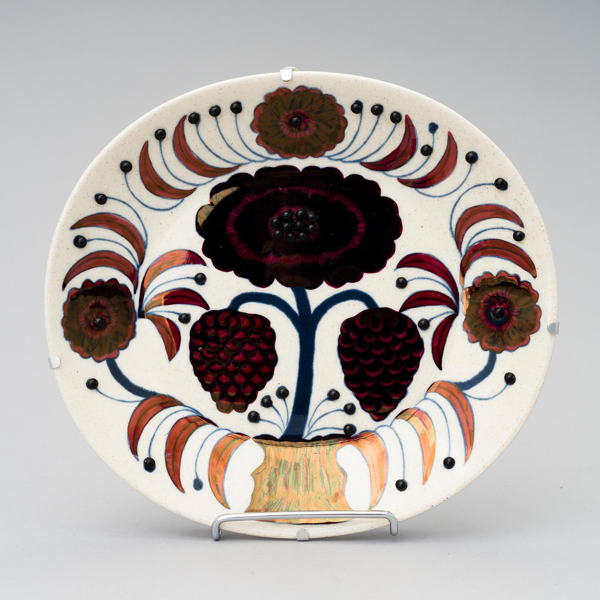 A ceramic 'Rose' wall plate by Birger Kaipiainen, marked Arabia