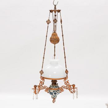 A ceiling carosene lamp, circa 1900.