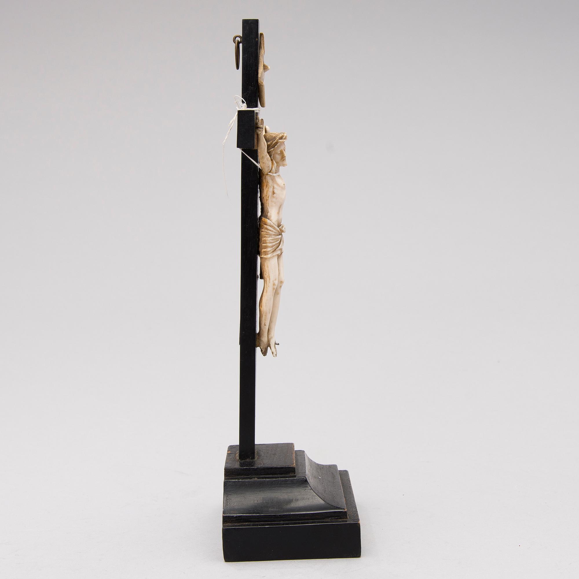 A WOODEN AND BONE TABLE CRUCIFIX with base. 19th Century.