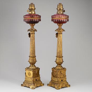 A pair of empire style table oil lamps, bronzed metal and glass, Dublot Freres, Rennes, late 19th century.