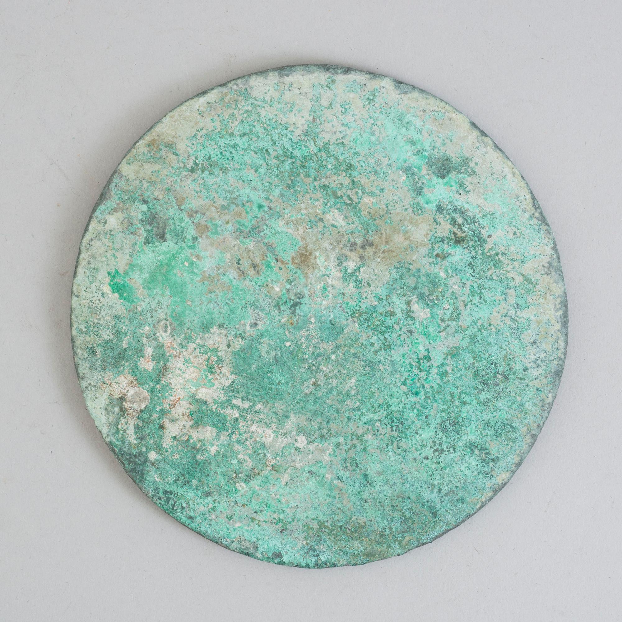 A bronze mirror, Xin-Eastern Han dynasty (9-220).