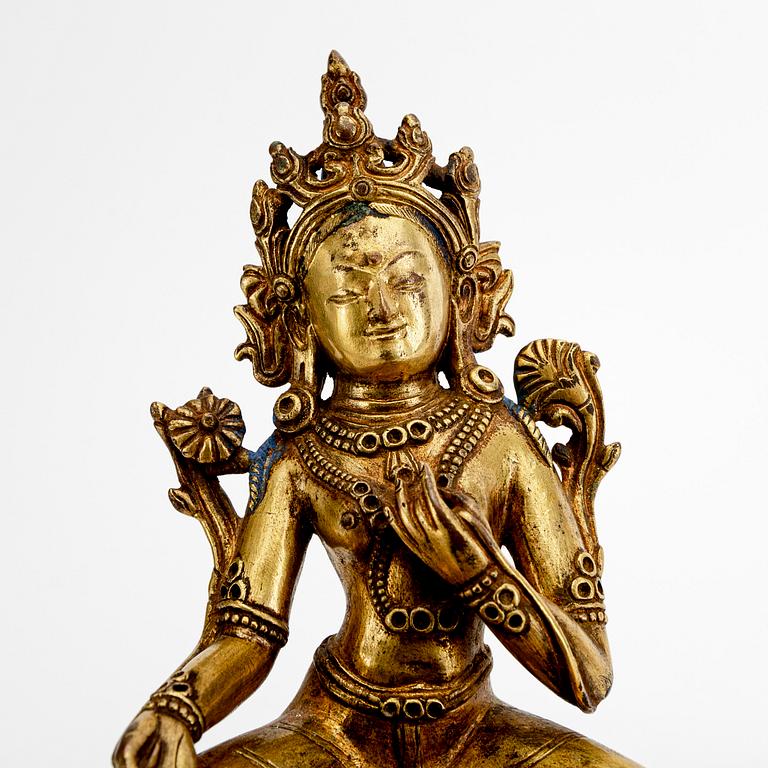 A Tibetochinese patinated bronze Tara figurine 20th century.