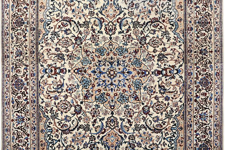 A Nain carpet, part silk, 9 laa, c. 318 x 209 cm.