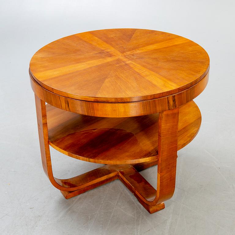 An Art deco style walnut coffee table alter part of the 19th century.