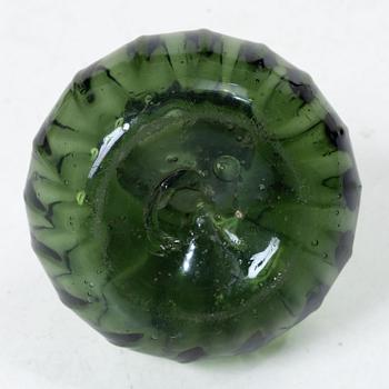 A green twisted glass bottle, 18th century.