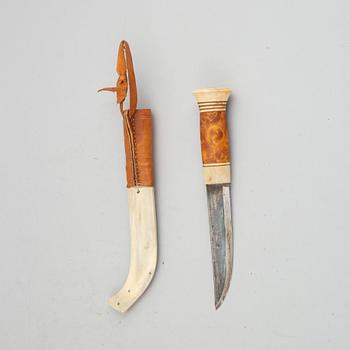 Esse Poggats, a reindeer horn Sami knife, signed.