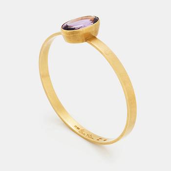 150. Wiwen Nilsson, an 18k gold bangle with a facet cut amethyst, Lund 1968.