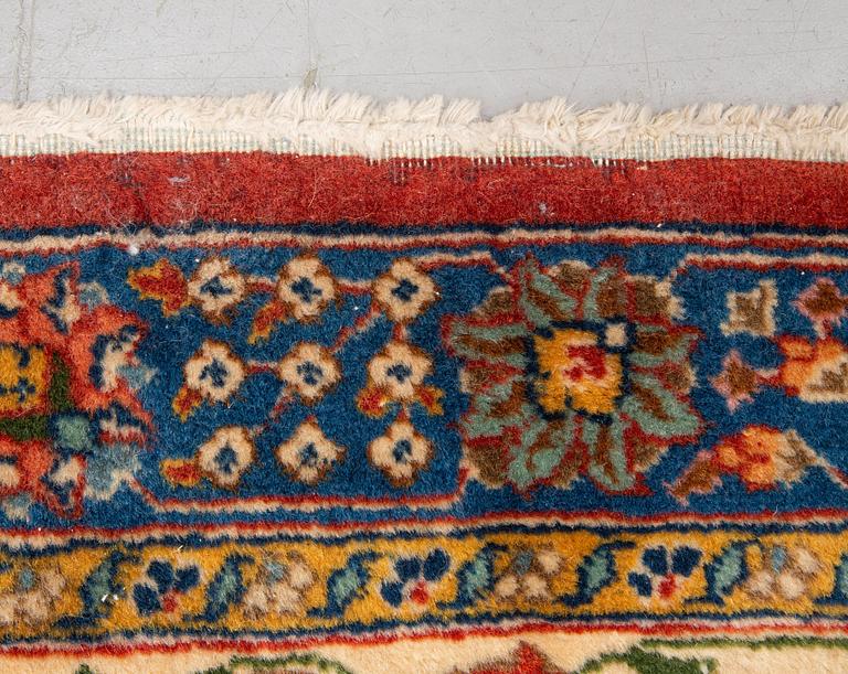 A carpet, a semi-antique Tabriz, ca 528-535 x 346,5-352,5 cm, signed Farhan.