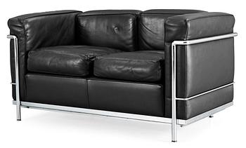 126. A Le Corbusier 'LC 2' two-seated black leather and chromed steel sofa, by Cassina, Italy.