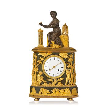 145. A French patinated and ormolu Directoire figural mantel clock, circa 1800.