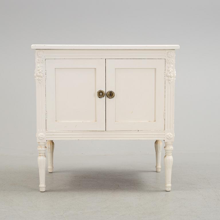 An early 20th century Gustavian style cupboard.