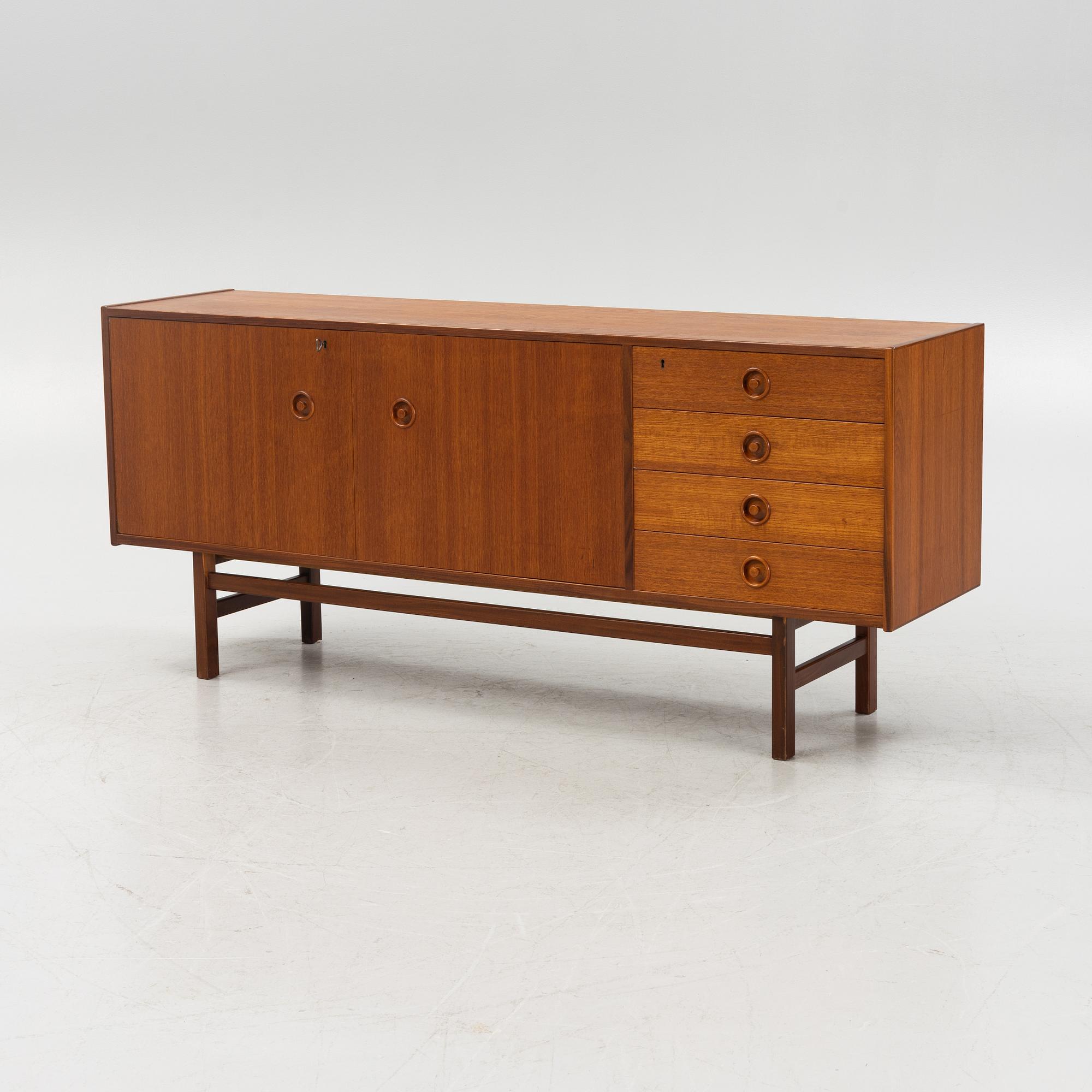 A 1960's teak-veneered sideboard.