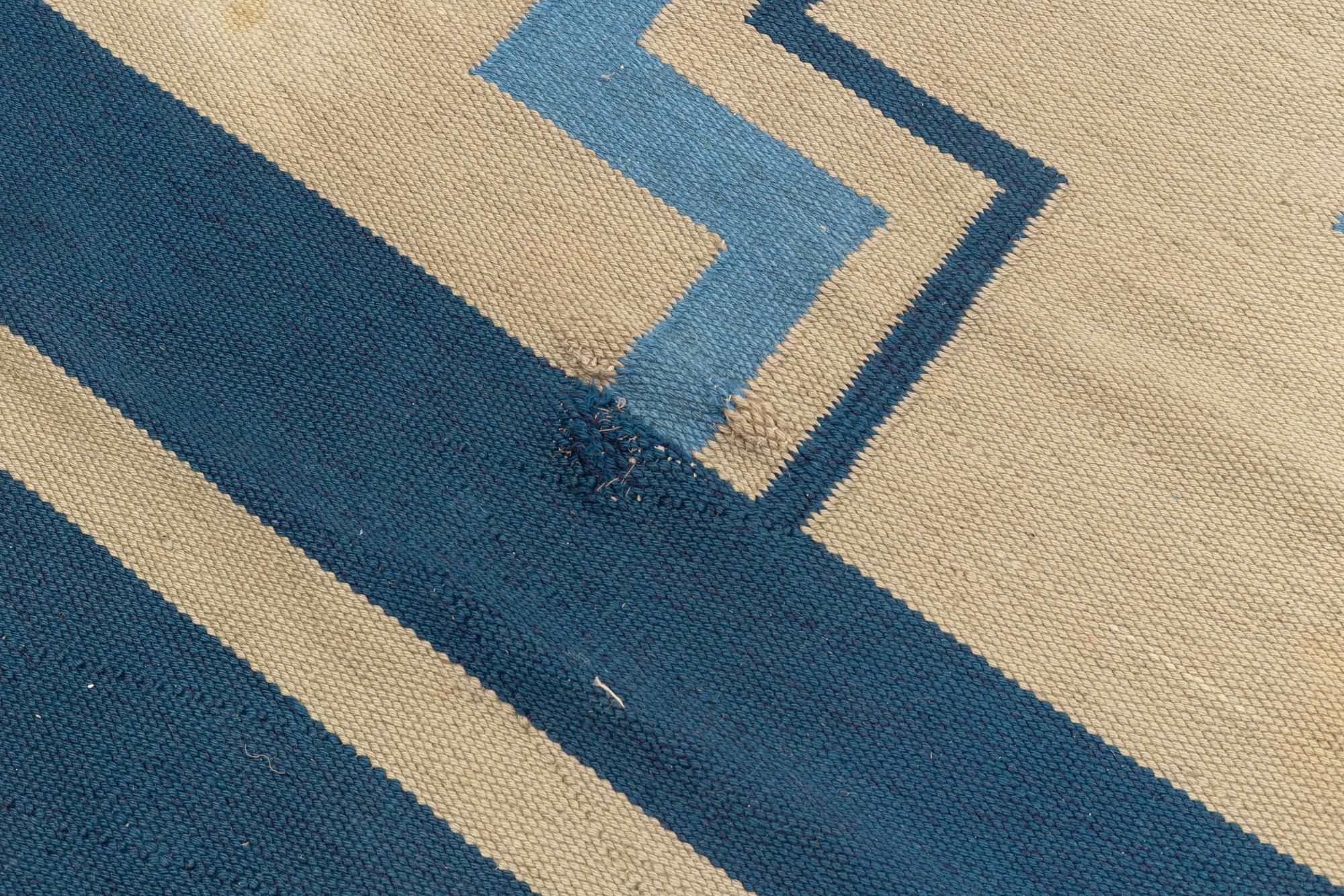 A flat weave carpet, Sweden, dated 1936, c. 370 x 260 cm.