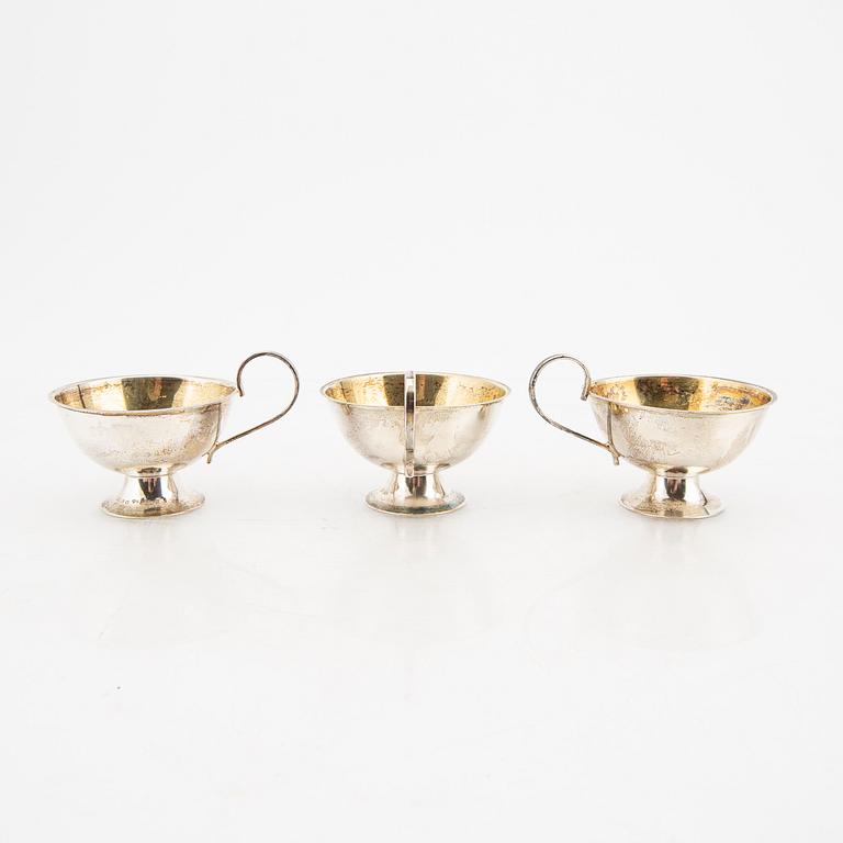 A Swedish 20th century set of 12 silver cups mark of Olof Pettersson Stockholm 1977 weight 336 grams.