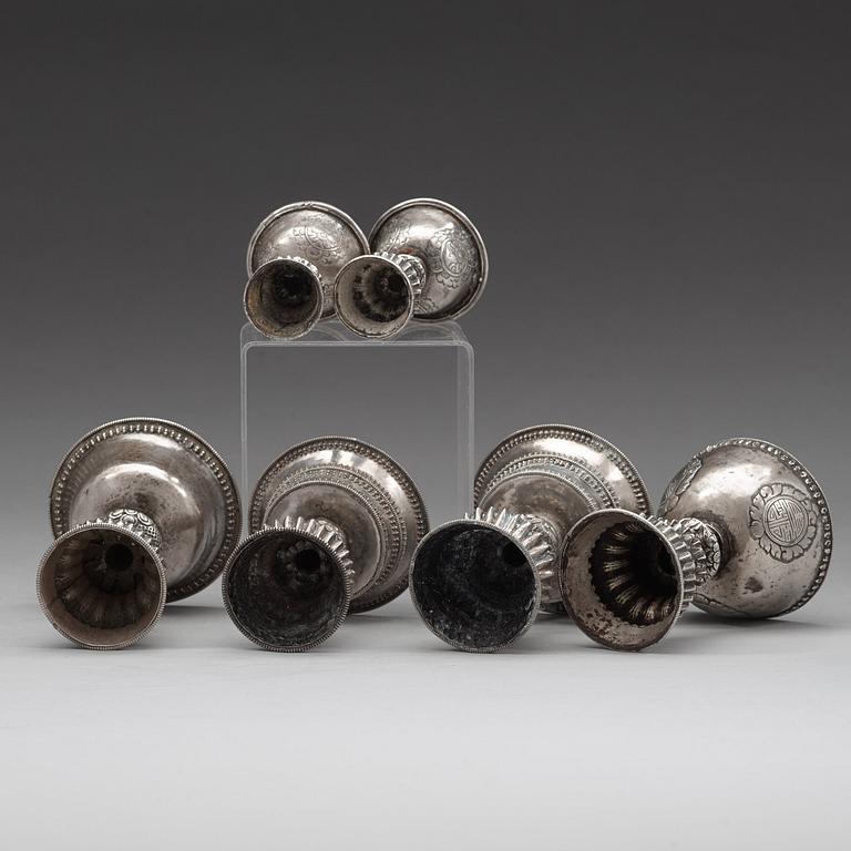 A group of six Tibetan silver/silvered Butter lamps, 19th Century.